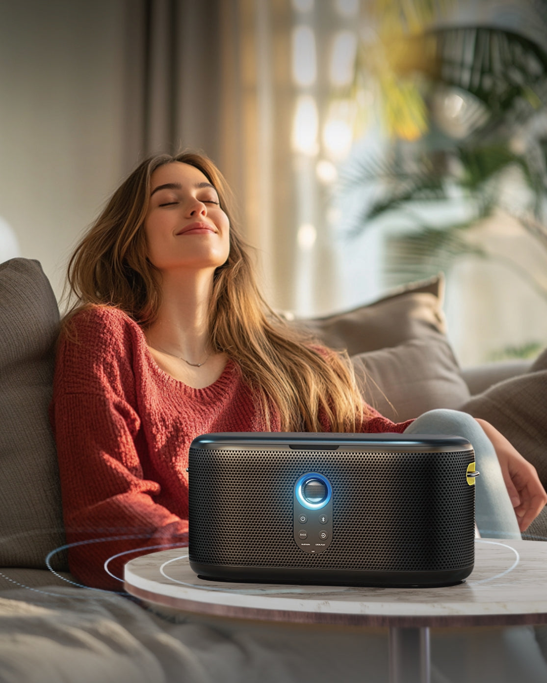 Woman relaxing while listening to an Ikarao speaker